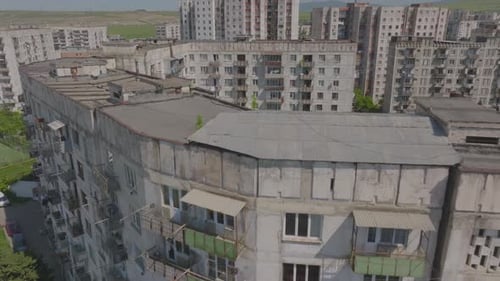 Aerial view of old Soviet era housing buildings architectural style and residential blocks with cars