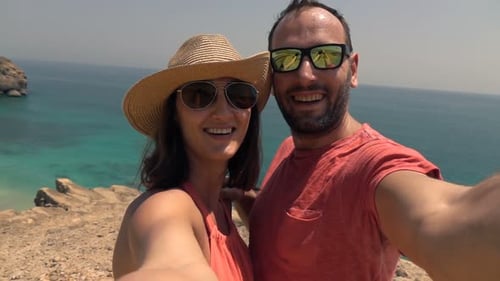 Couple Recording Video, Taking Selfie on Cliff Near Sea, Super