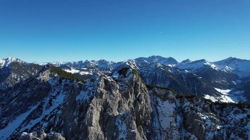 Time lapse aerial shot around the mountain Alpsitz in Liechtenstein next to Switzerland and Austria.