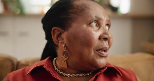 Thinking, memory and mature woman on sofa in living room with reflection facial expression