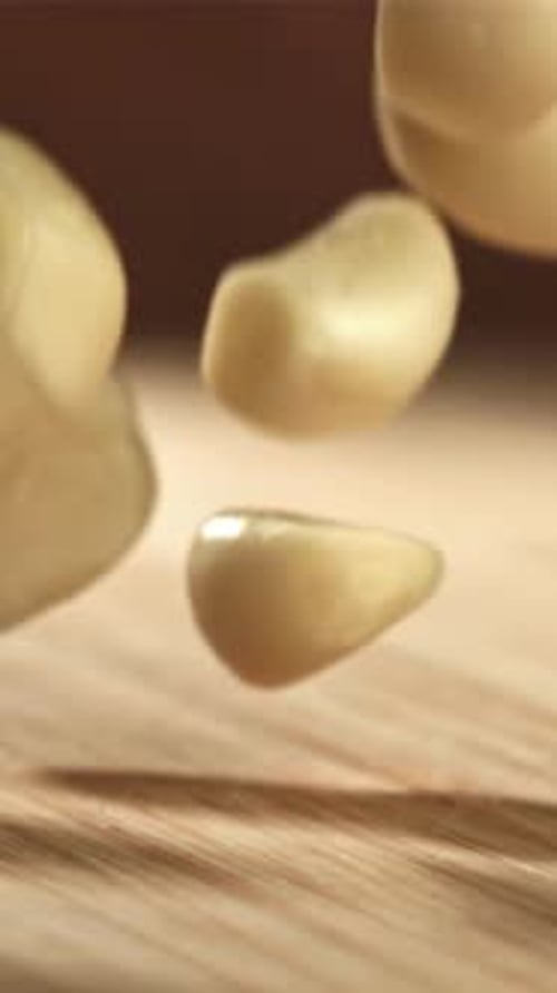 Fresh Garlic Falls on a Cutting Board Filmed on a Highspeed Camera at 1000 Fps
