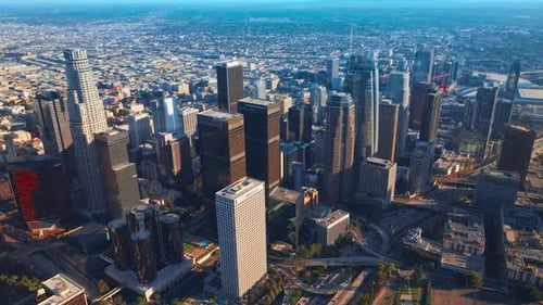 Marvelous Los Angeles skyscrapers in financial downtown. City scenery with hazy horizon at backdrop.