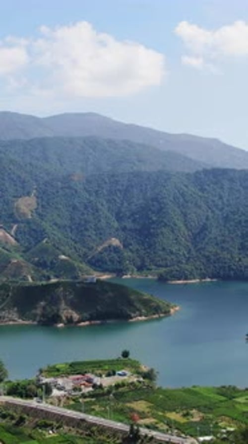 This Breathtaking Mountain Lake Landscape is Beautifully Framed Under a Clear Blue Sky Media
