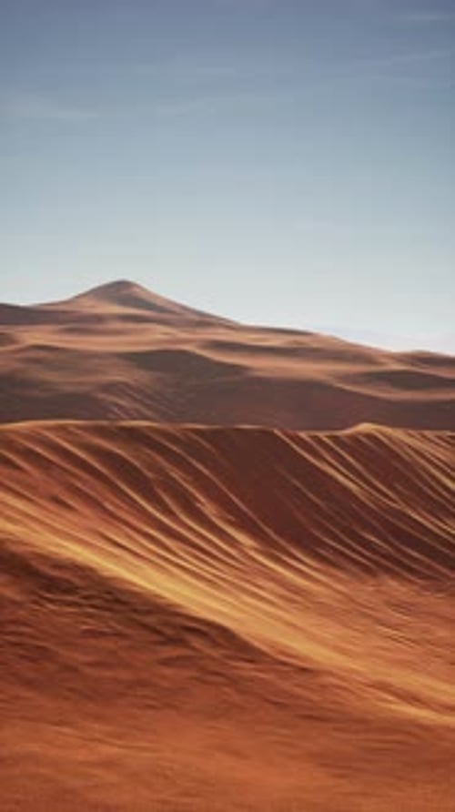 Arid Desert Landscape With Distant Mountain