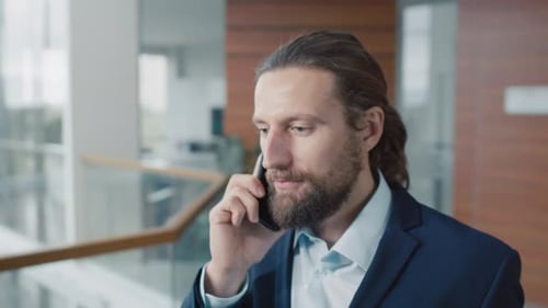 Businessman Talking to Client on Mobile Phone