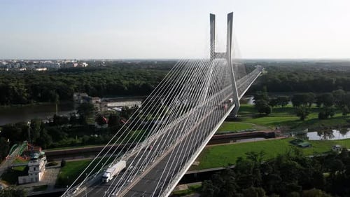 Aerial View of Car Traffic on Modern Cablestayed Bridge Over River