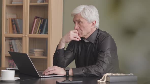 Senior Priest Working on Laptop from Home, Religious Stock Footage ft ...