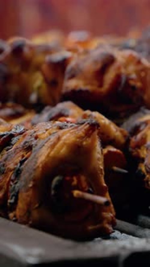 Vertical video Grilling succulent pork skewers for festive holidays at a local shop