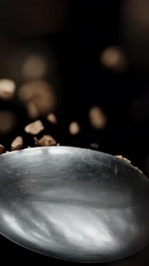 Vertical video. I Pour Granulated Coffee from a Spoon, the Concept of Morning Awakening. Slow-Motion