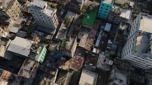 Slum area in an urban city, urbanization concept - top tilt up establishing shot