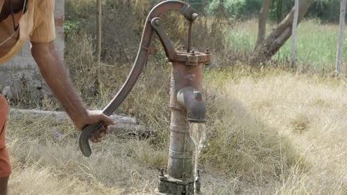 Hands-On Water Flow Control with a Classic Hand Pump