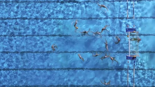 Aerial Drone Top View of Swimming Pool with Athletes Training Water Polo