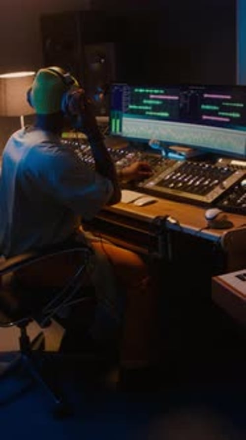 Black Male Sound Engineer Working on Music Track in Recording Studio