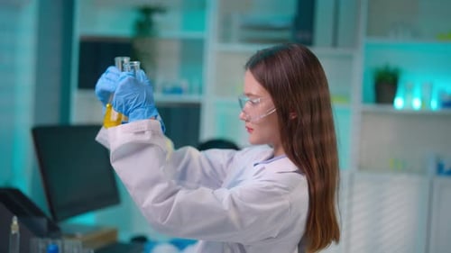 Asian female scientist working in biotechnology research laboratory.