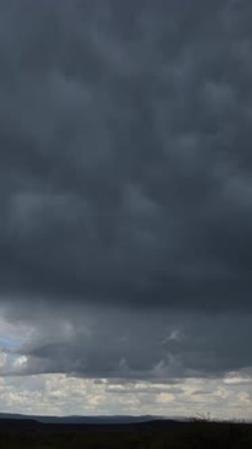 Dramatic Storm Clouds Over a Rural Landscape
