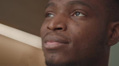 Black Man Opening His Eyes Close Up African American Man Smiling to the Side