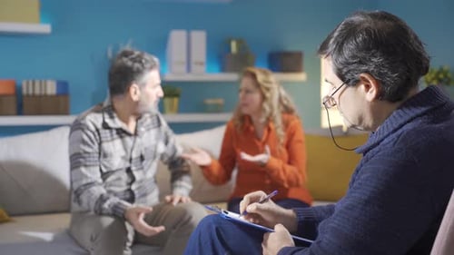 Middle-aged couple and psychiatrist.