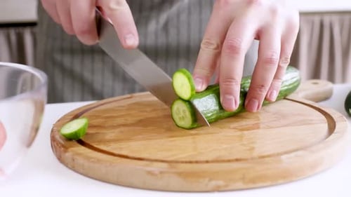 Cucumber Slicing on Cutting Board
