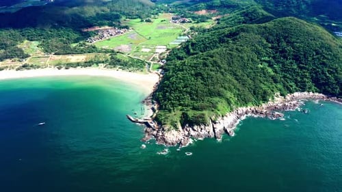 Aerial Top view of a transparent blue sea with beautiful waves at sunny day in summer. air of ocea