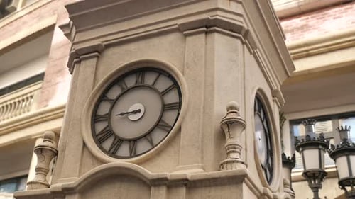Vintage Clock Tower Displays Time in City Square