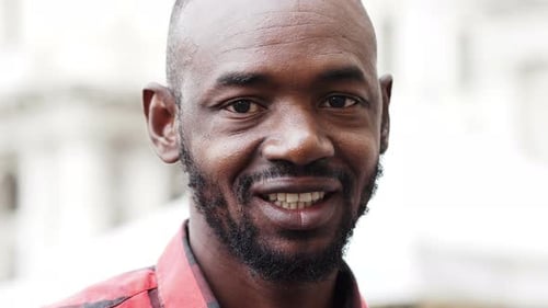 Smiling happy black african man - close up