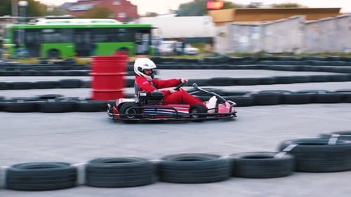 Racer Driving Go Kart on Outdoor Track in Competition