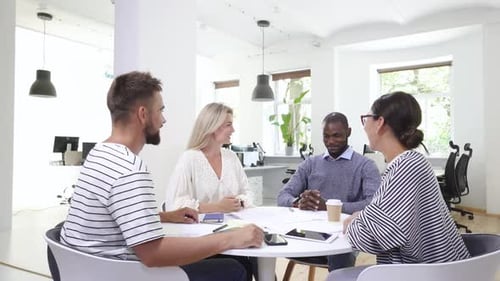 Business Multiethnic Team Working Together in a Meeting