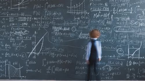 Time Lapse of Smart Little Boy Writing Maths Formulas on Chalkboard Wall Focused on Calculation in