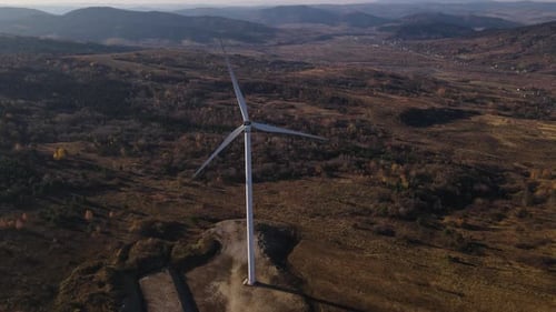 Aerial Panoramic View on a Windmill Drone Flies Forward Rotating Blades of Wind Turbine Against