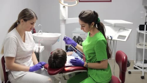 Comprehensive Dental Examination of a Child in a Modern Clinic with Highquality Professional Service
