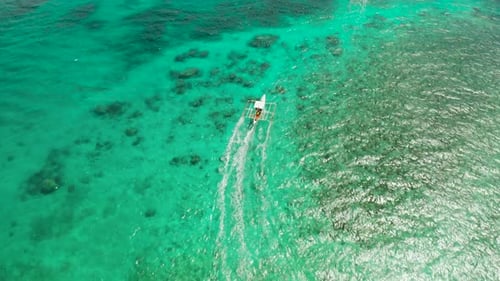 Seascape Coral Reef and Blue Sea with Motorboat