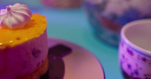 Delicious Mini Cake with Meringue Topping and Teacup