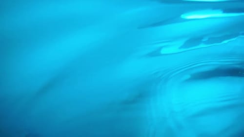 Abstract Water Surface with Blue Ripples