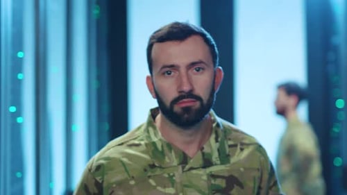 Man in Camouflage in Server Room, close up
