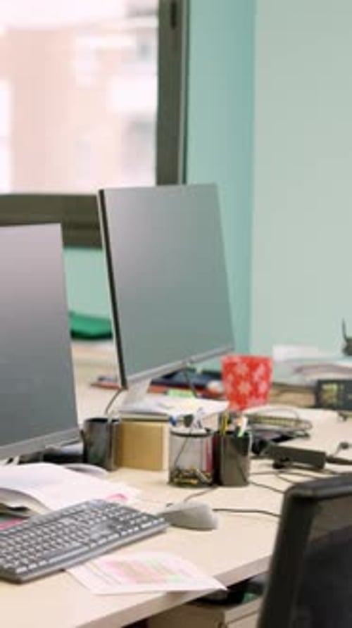 Modern Workplace with Desks and Computer Monitors