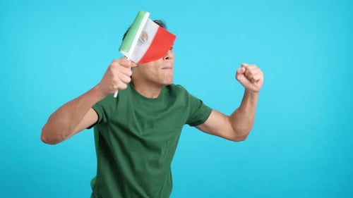 Enthusiastic Young Adult Cheering with a Flag