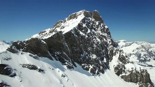 Majestic SnowCapped Peaks Against a Blue Winter Sky