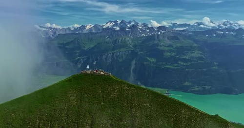 Drone Flies Over Green Picturesque Valley with Mountains in the Background High Mountains Famous