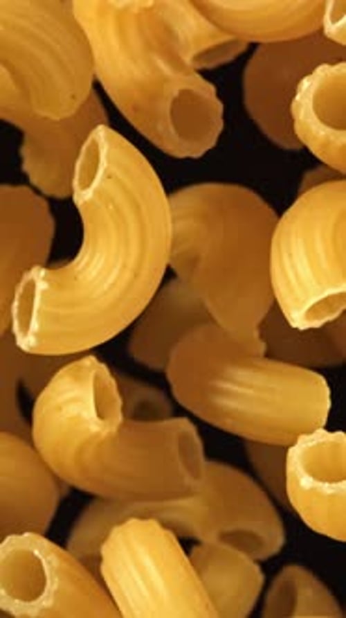 Super Slow Motion Flying Dry Macaroni Pasta Filmed on a Highspeed Camera at 1000 Fps