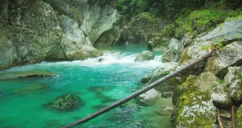 Azure water of mountain river flows in rocky gorge