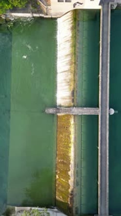 Aerial video of people vacationing along a river in Zurich, Switzerland
