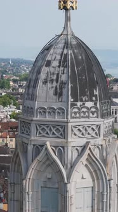 Aerial video of the Swiss flag at the Grossmunster church and the city in the background.
