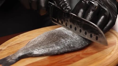 chef cooking fish in the kitchen. Close-up shots