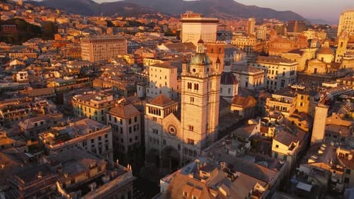 Genoa's historical center at sunset, highlighting its iconic architecture, aerial view