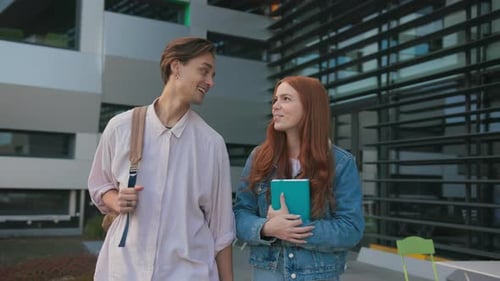 Caucasian Couple of Handsome Student with Ginger Girlfriend Communicating While Leaving Campus