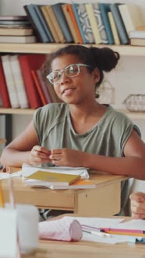 African American School Girl Asking Question during Lesson