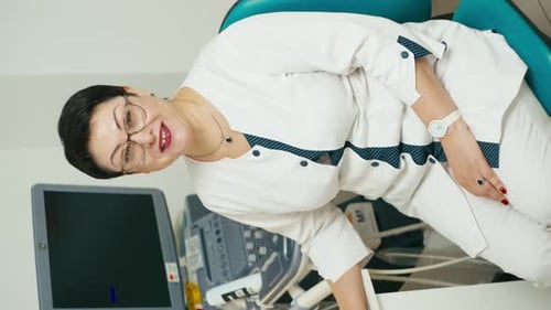 Woman Doctor Posing Beside Ultrasound Machine