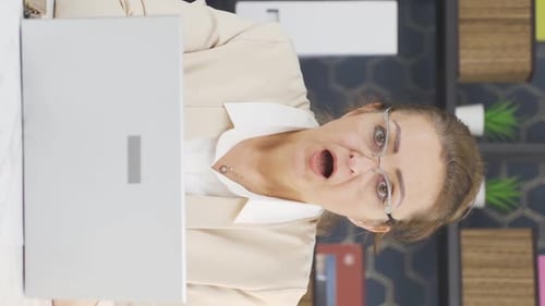 Surprised Woman Working at Desk in Business Office