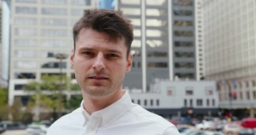 Young Adult Man Looking at the Camera in City