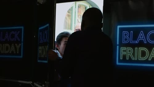 Black Friday Shopping Crowd Pushing Through Door